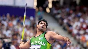 AP/Matthias Schrader : Pakistan's Arshad Nadeem in action at the men's javelin throw event of Paris Olympics.