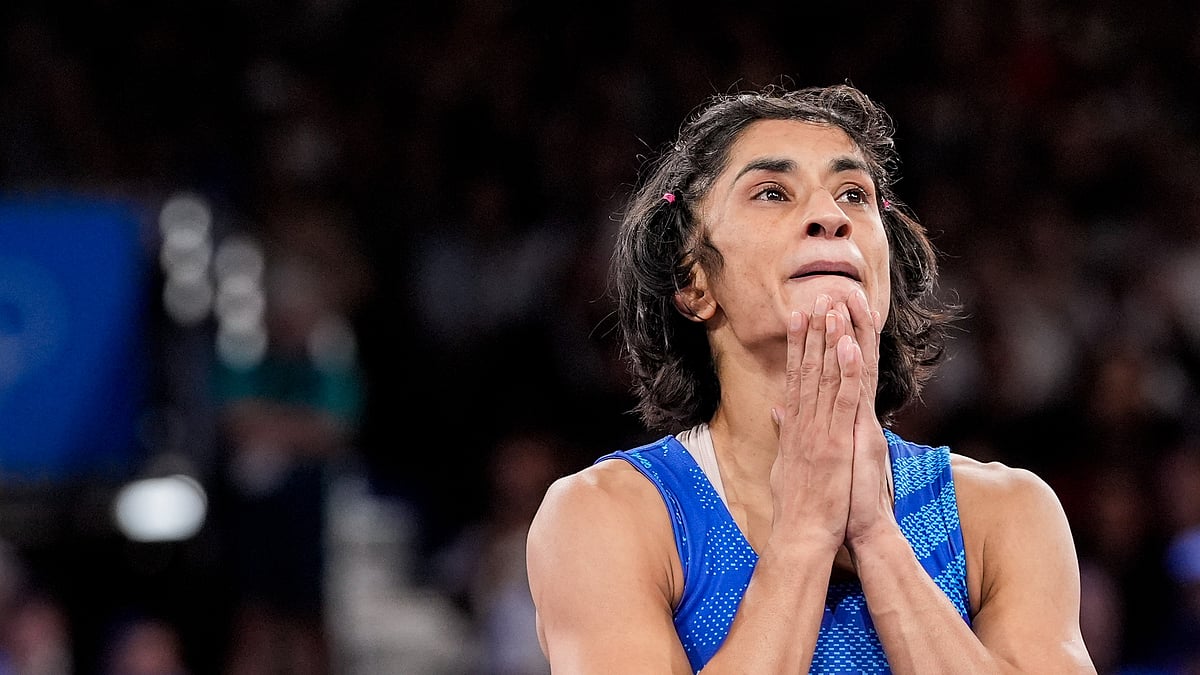 Eugene Hoshiko/AP Photo via PTI : Indian wrestler Vinesh Phogat reacts after the round of 16 of the women's freestyle 50kg wrestling match against Japan's Yui Susaki, at Champ-de-Mars Arena, in Paris.