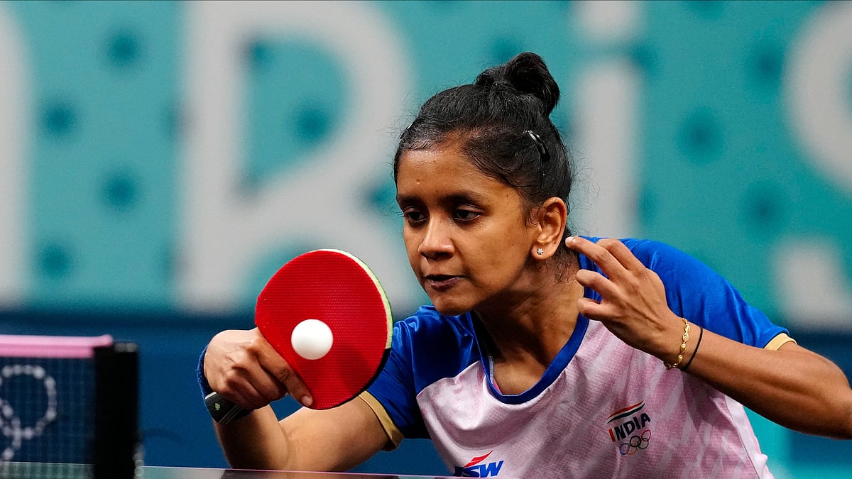 AP Photo/Petros Giannakouris : India's Sreeja Akula plays against Romania's Elizabeta Samara during a women's teams round of 16 table tennis match at the 2024 Summer Olympics.