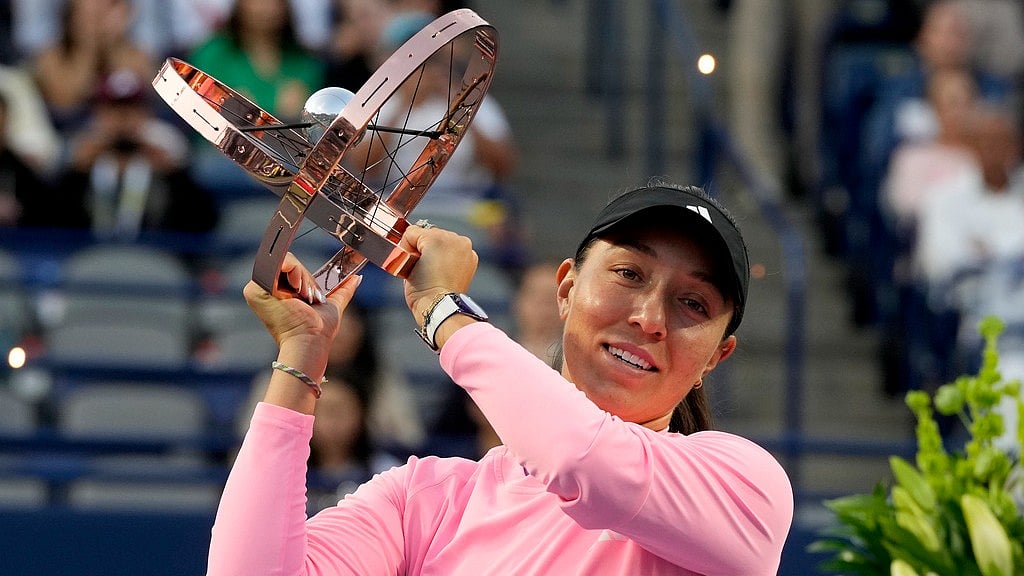 Frank Gunn/The Canadian Press via AP : Jessica Pegula, of the United States, lifts her trophy following her women's singles win at the National Bank Open tennis tournament in Toronto.