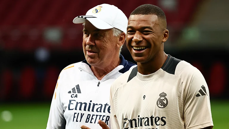 Carlo Ancelotti and Kylian Mbappe in Madrid colours - null