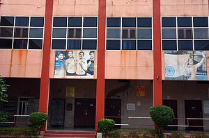 Photo by Tribhuvan Tiwari/Outlook : A picture of the Phogat sisters on the wall at Mahavir Phogat VMPS in Jhojhu Kalan, Haryana