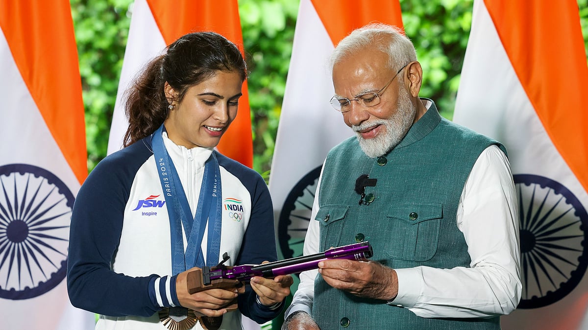PTI via narendramodi.in : Prime Minister Narendra Modi with bronze medallist shooter Manu Bhaker during his interaction with the Indian contingent for Paris Olympics, in New Delhi, Thursday, Aug. 15, 2024. 