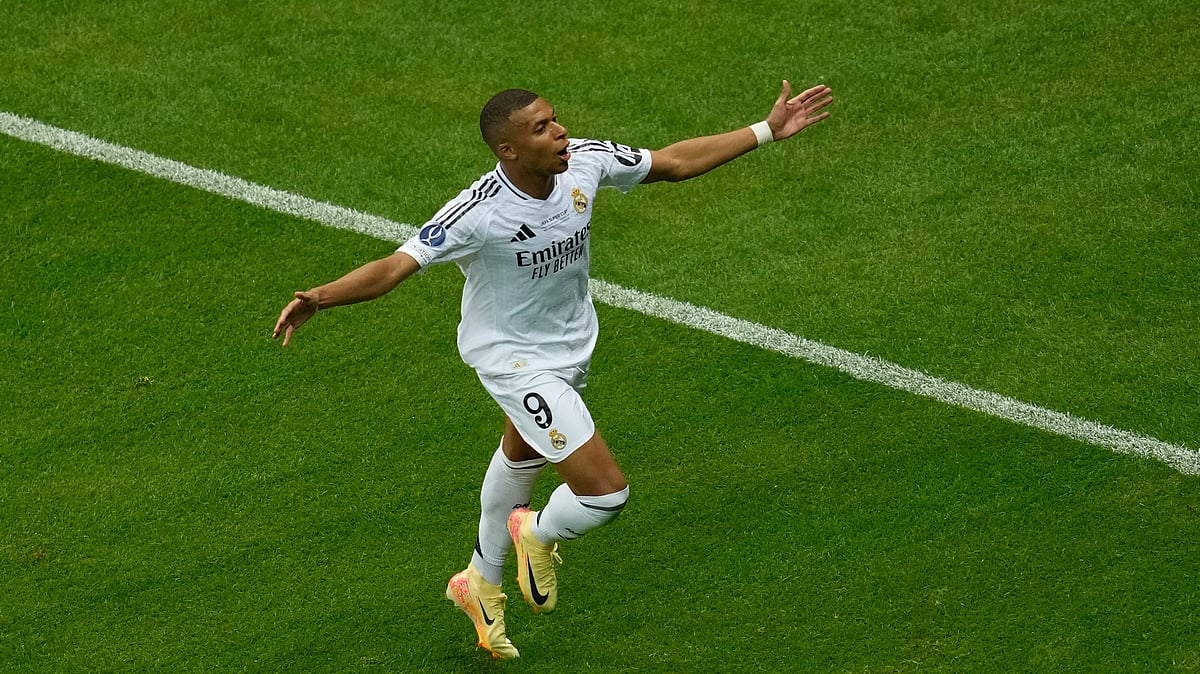 AP Photo/Darko Vojinovic : Real Madrid's Kylian Mbappe celebrates after scoring his side's second goal during the UEFA Super Cup Final soccer match between Real Madrid and Atalanta at the Narodowy stadium in Warsaw, Poland.