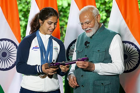 Prime Minister Narendra Modi with bronze medallist shooter Manu Bhaker