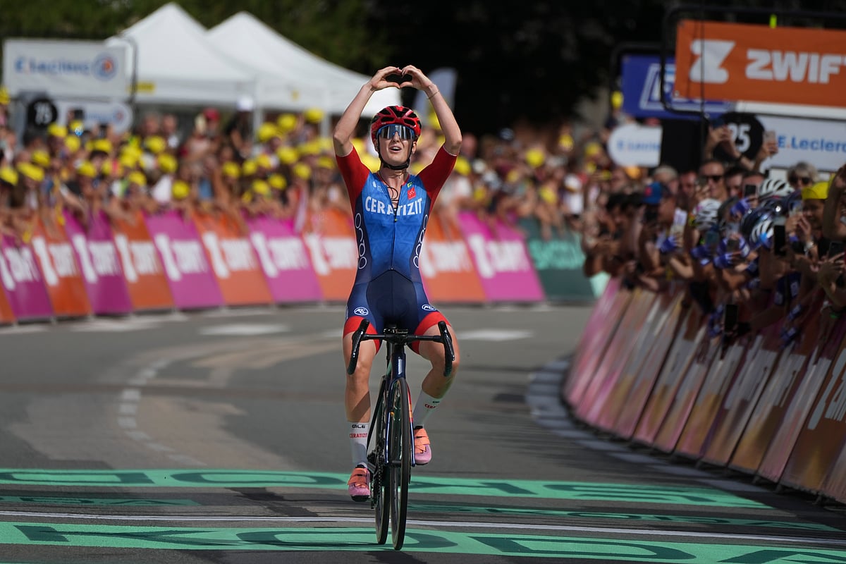 Cedrine Kerbaol of France forms a heart as she celebrates winning the sixth stage of the Tour de France Women cycling race with start in Remiremont and finish in Morteau, France, Friday, Aug. 16, 2024.

 -  (AP Photo/Peter Dejong)