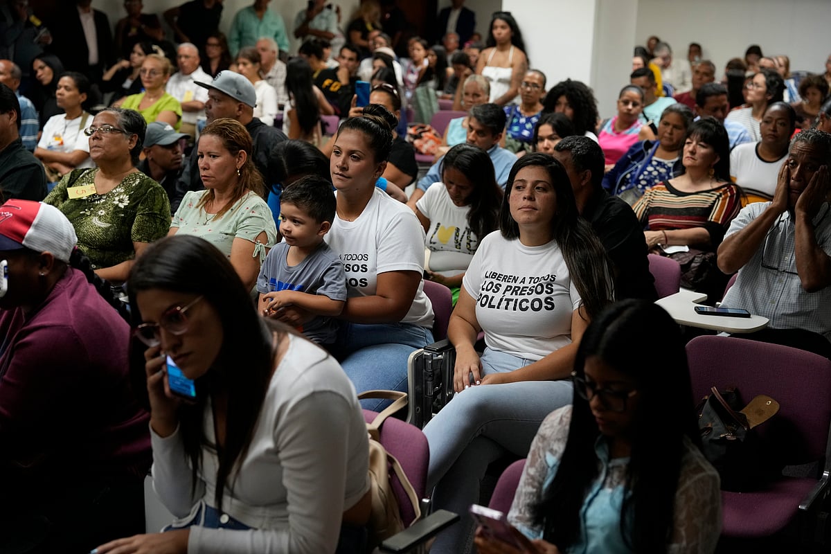 AP : A woman holds up a book titled, “What are Human Rights” during a meeting with local human rights groups to provide guidance to family members whose relatives were detained during a government crackdown in response to anti-government protests that erupted throughout the country after President Nicolas Maduro was declared winner amid allegations of fraud, in Caracas, Venezuela, Thursday, Aug. 15, 2024