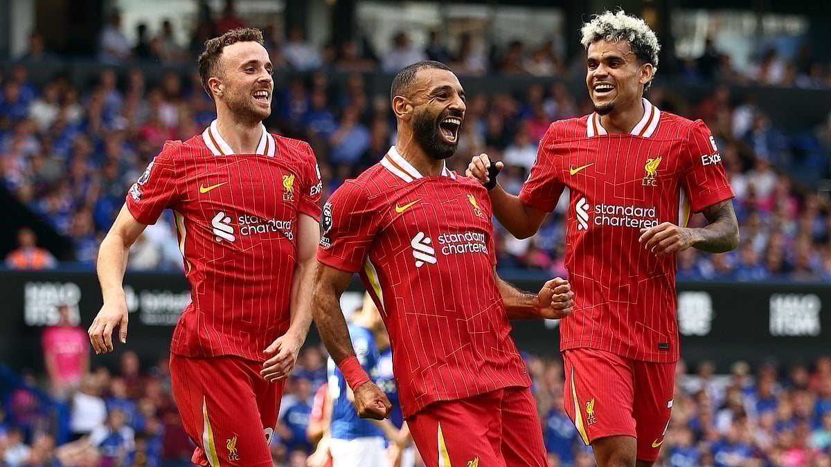 Salah (centre) celebrates with Diogo Jota and Luis Diaz - null