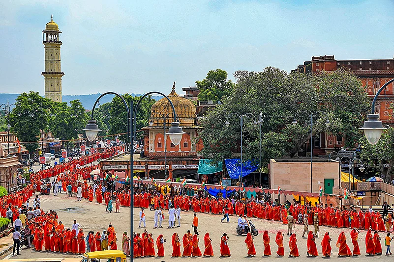 Women devotees carry holy water as they take part in Kalash Yatra during Shravan month, in Jaipur