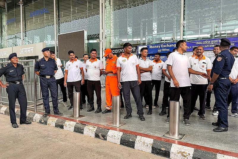 Staffers outside Lucknow Airport after alleged leakage of fluorine gas that caused chaos in area