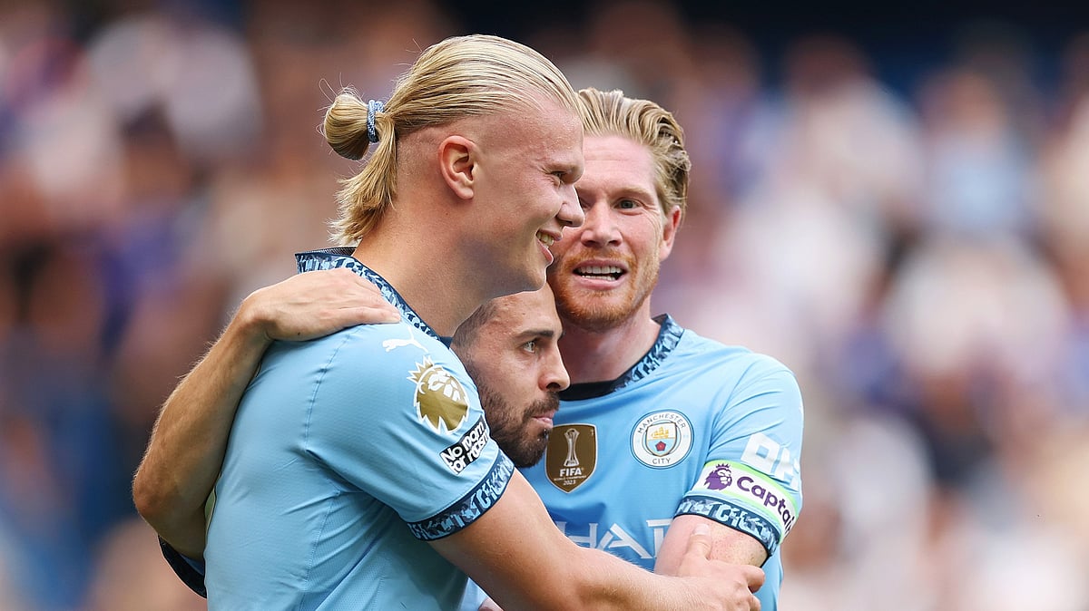 Erling Haaland (left) helped Manchester City get off to a winning start on Sunday.