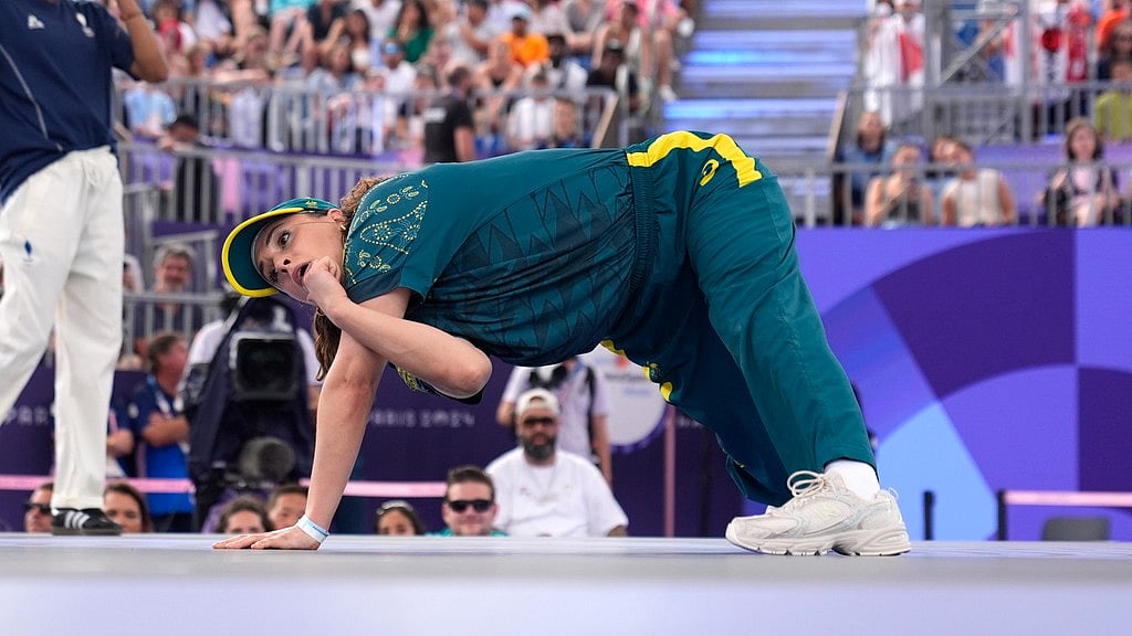 AP : Australia's Rachael Gunn, known as B-Girl Raygun, competes during the Round Robin Battle at the breaking competition at La Concorde Urban Park at the 2024 Summer Olympics, Friday, Aug. 9, 2024, in Paris, France.