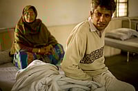 (Photo by In Pictures Ltd./Corbis via Getty Images)
 : A mentally ill man and his wife