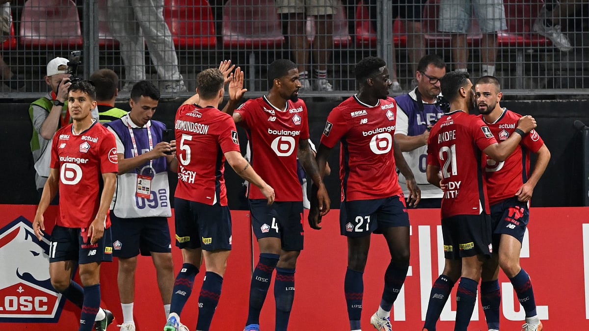 Lille players celebrate a goal in Ligue 1.