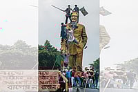 The BNP Seeks A Return To Democracy In Bangladesh Photo: Getty Images : Bring it Down: Protestors climbing a statue of Sheikh Mujibur Rahman in Dhaka