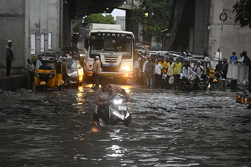 Weather: flooded road after heavy monsoon rains in Hyderabad