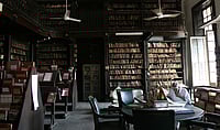 Getty Images : Lost in the sea of books - A man surfs through the books in National Library Bandra