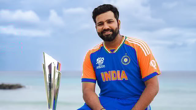 File photo of Rohit Sharma posing with the ICC T20 World Cup 2024 trophy in Barbados. - X/BCCI