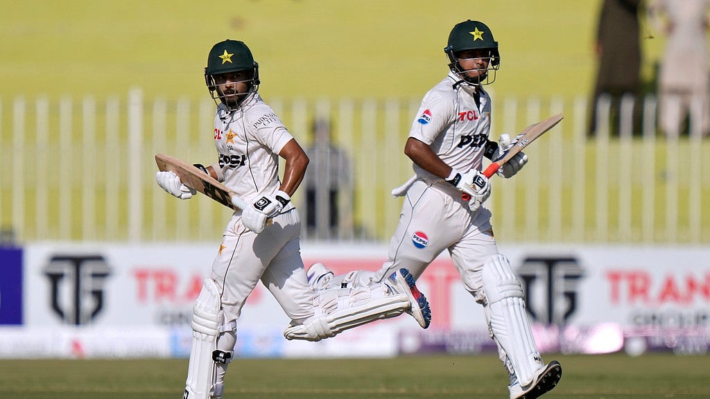 Photo: AP/Anjum Naveed : Saud Shakeel, left, and Saim Ayub run between the wickets during the first day of the first Test match between Pakistan and Bangladesh, in Rawalpindi on Wednesday (August 21, 2024).