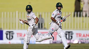 Photo: AP/Anjum Naveed : Saud Shakeel, left, and Saim Ayub run between the wickets during the first day of the first Test match between Pakistan and Bangladesh, in Rawalpindi on Wednesday (August 21, 2024).