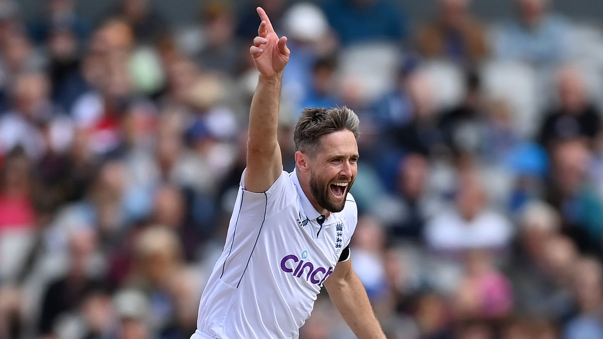 Chris Woakes celebrates dismissing Angelo Mathews at Old Trafford.