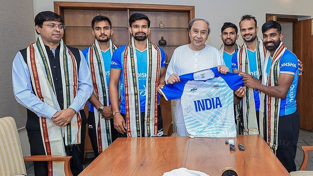 | Photo: PTI : Naveen Patnaik meets men's hockey team.