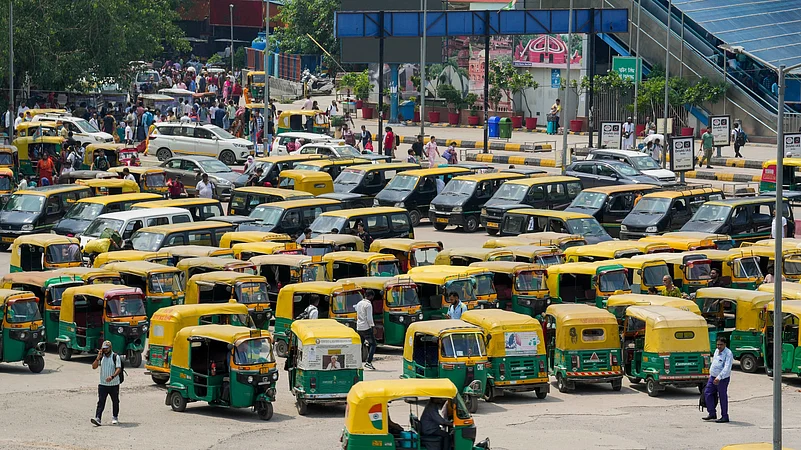 Taxis and auto rickshaws stand parked outside New Delhi Railway Station on Thursday