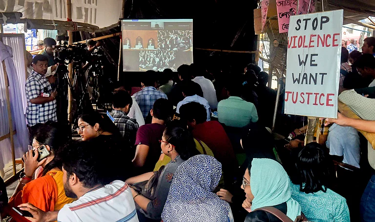 Resident doctors of RG Kar Medical College and Hospital watch live streaming of the Supreme Court hearing - (PTI Photo)