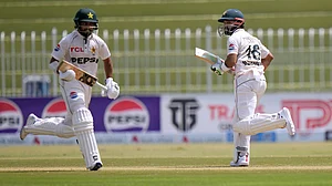 AP/Anjum Naveed : Pakistan's Mohammad Rizwan, right, and Saud Shakeel run between the wickets during the second day of first cricket Test.
