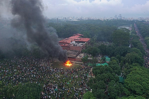 Drik : In this aerial view, fires burn outside the Prime Minister's House after Bangladesh Prime Minister Sheikh Hasina resigned and fled the country.