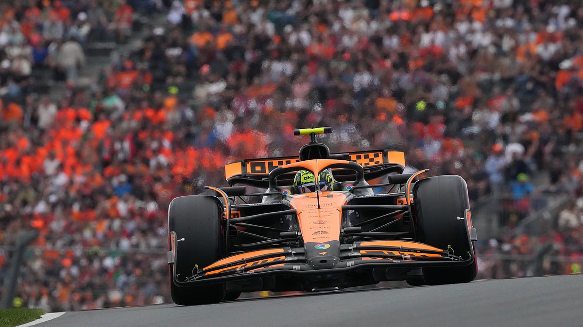 (AP Photo/Peter Dejong) : McLaren driver Lando Norris of Britain steers his car during qualifying session ahead of the Formula One Dutch Grand Prix race at the Zandvoort racetrack, Netherlands, Saturday, Aug. 24, 2024. 