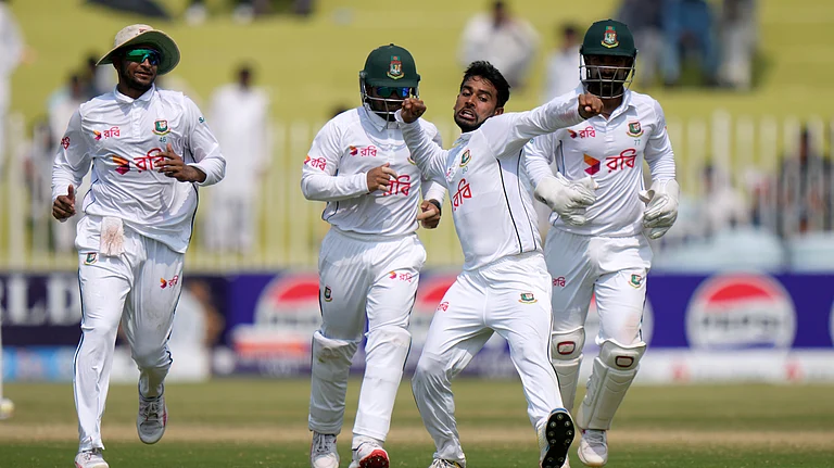 Bangladesh's Mehidy Hasan Miraz, centre, celebrates after taking the wicket of Pakistan's Mohammad Rizwan during the fifth day of first Test in Rawalpindi on Sunday (August 25, 2024). - AP/Anjum Naveed