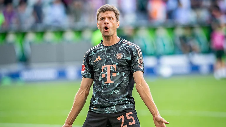 Thomas Muller celebrates Bayern Munich's win - null