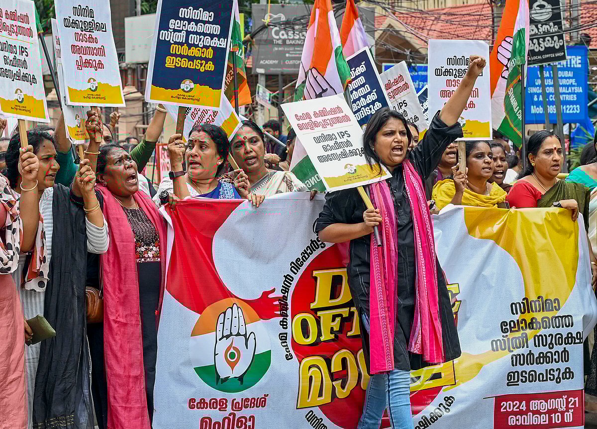-PTI Photo : Mahila Congress activists stage a protest demanding a case against the perpetrators named in the Hema Committee report,