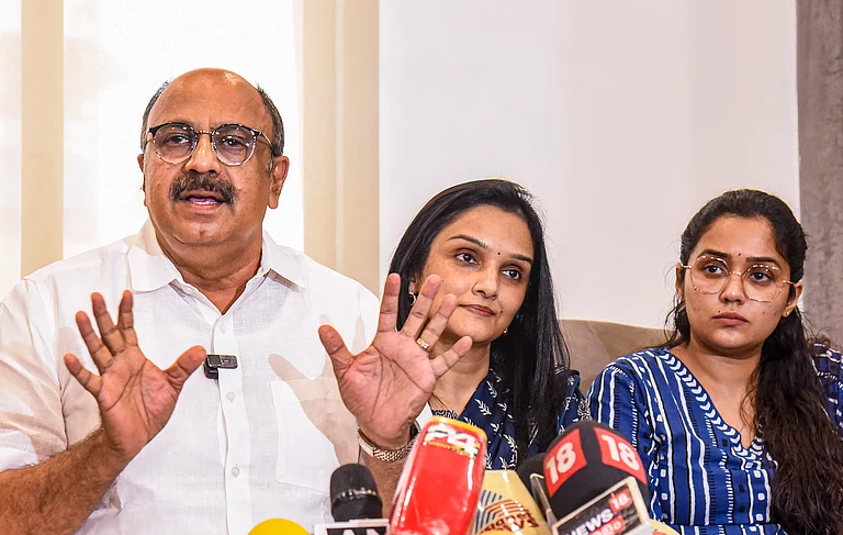 General Secretary of Association of Malayalam Movie Artists (AMMA) Siddique with actors Jomol and Ananya in Kochi - PTI Photo