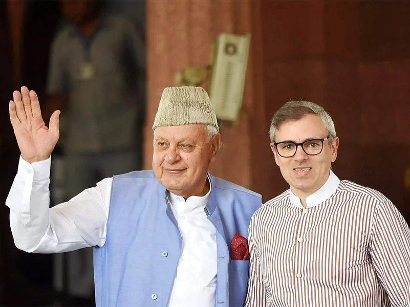 National Conference leaders Dr Farooq Abdullah (left) and Omar Abdullah (right) |