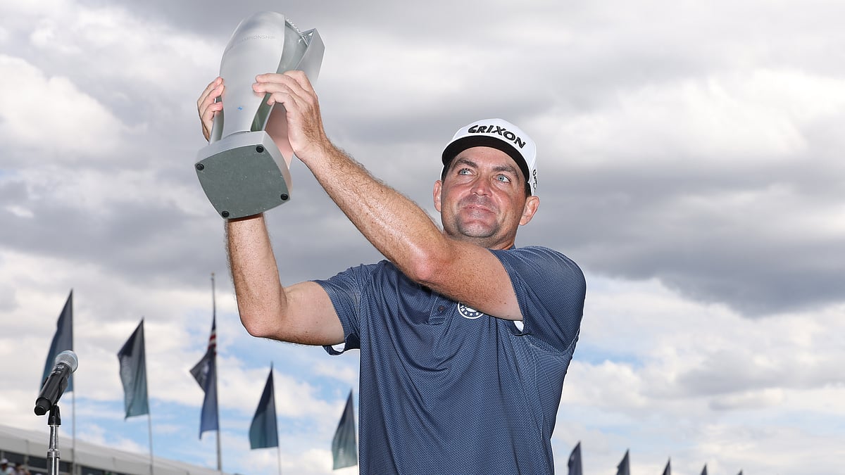 Keegan Bradley holds the BMW Championship trophy aloft
