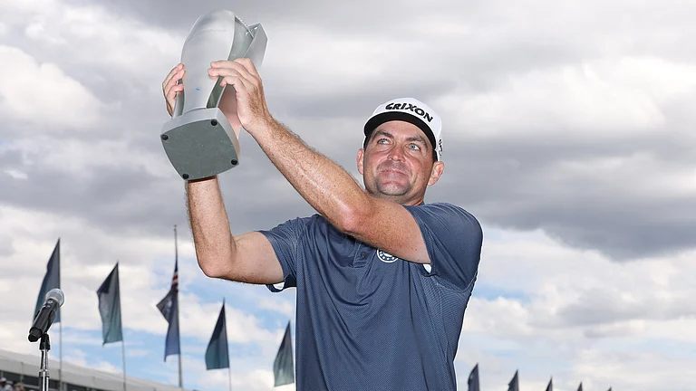 Keegan Bradley holds the BMW Championship trophy aloft - null