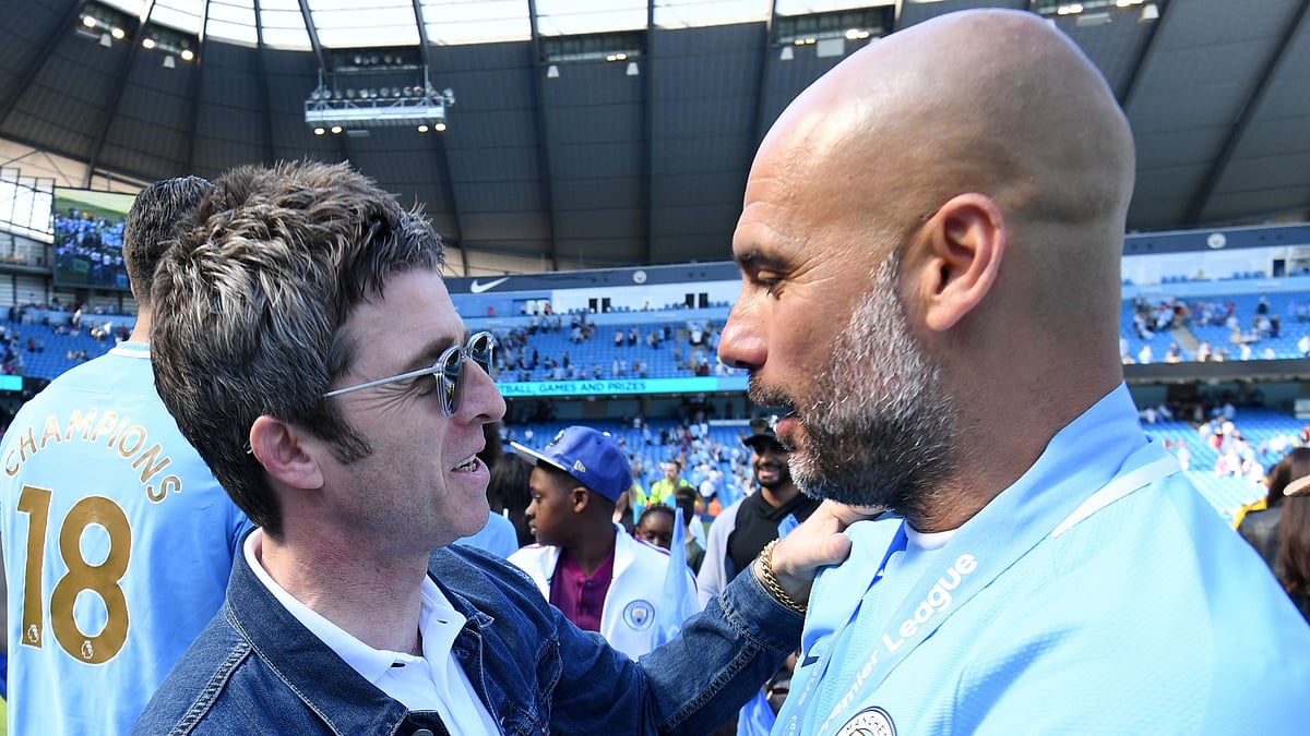 One half of Oasis, Noel Gallagher (left), with Manchester City manager Pep Guardiola