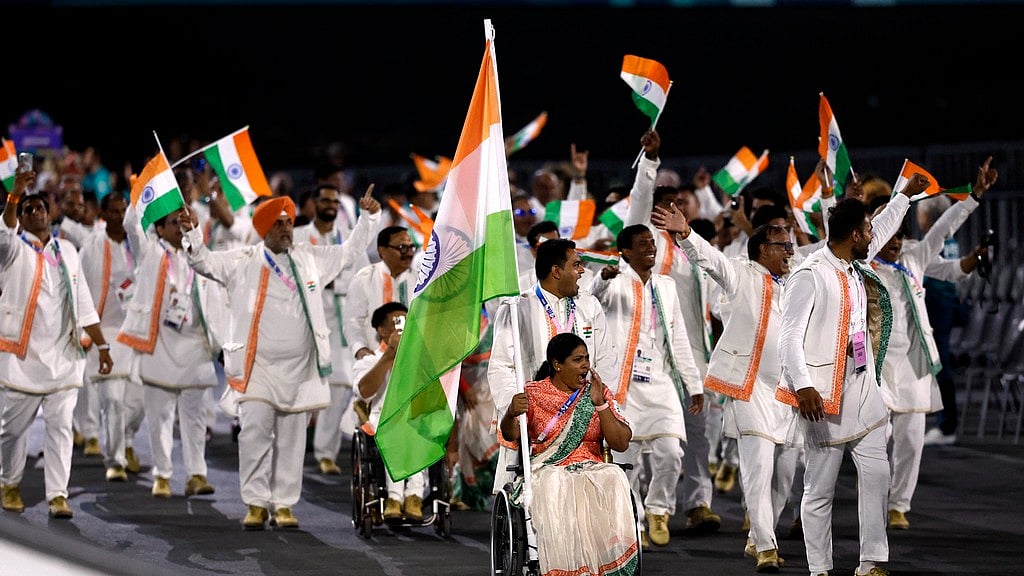 Flagbearers Bhagyashri Mahavrao Jadhav of India and Sumit of India lead their contingent during the Opening Ceremony for the 2024 Paralympics. - AP