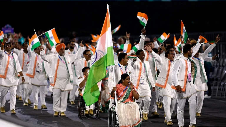 Flagbearers Bhagyashri Mahavrao Jadhav of India and Sumit of India lead their contingent during the Opening Ceremony for the 2024 Paralympics. - AP