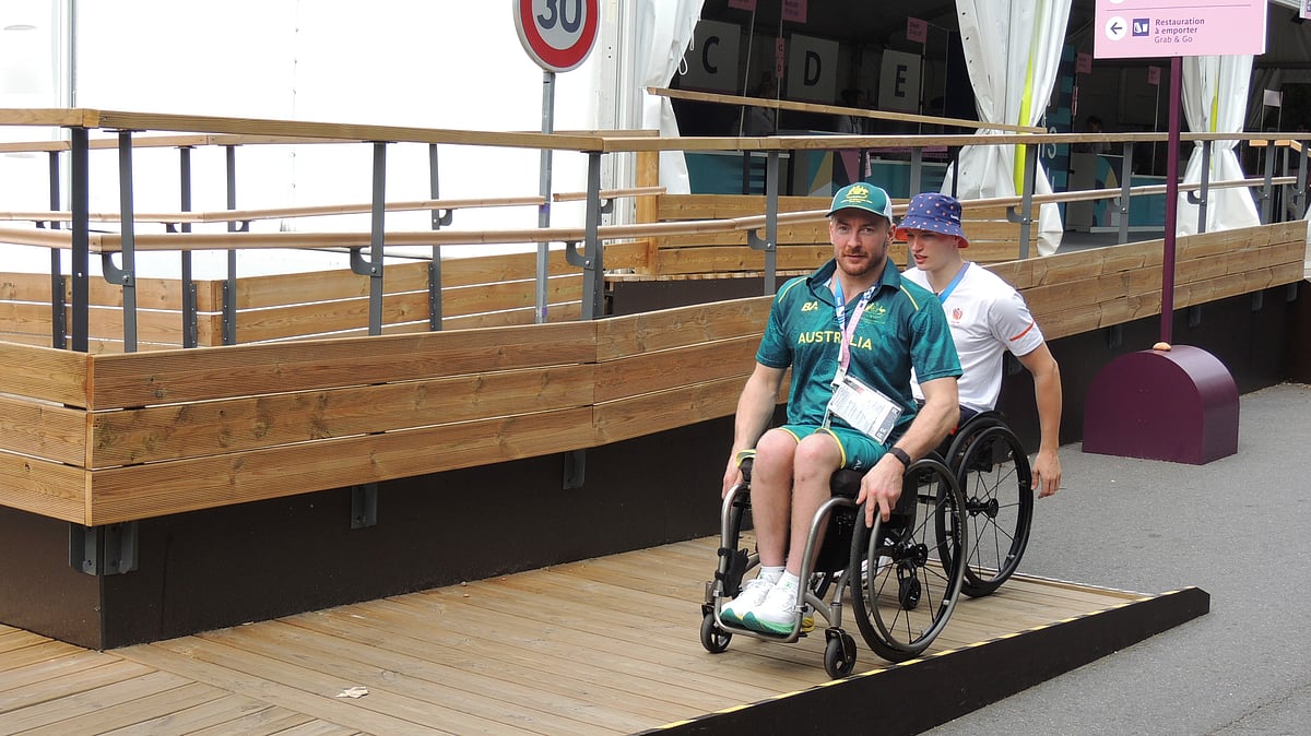 Two para athletes in wheelchairs using a ramp in the Paralympic Games Village, in Saint-Ouen, France. - AP