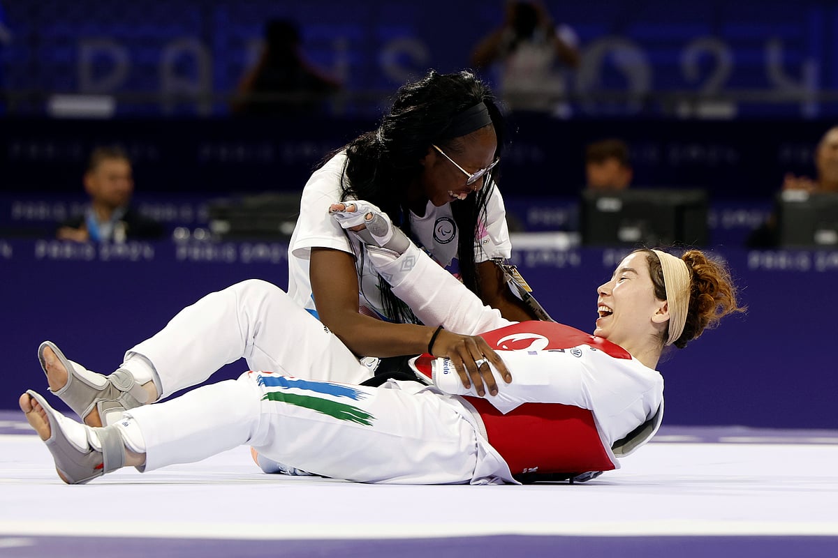 (AP Photo/Madeleine Mertens)
 : Zakia Khudadadi from the Paralympic Refugee Team, bottom, celebrates her bronze medal in Para Taekwondo during the Paralympic Games in Paris, Thursday, Aug. 29, 2024. 

