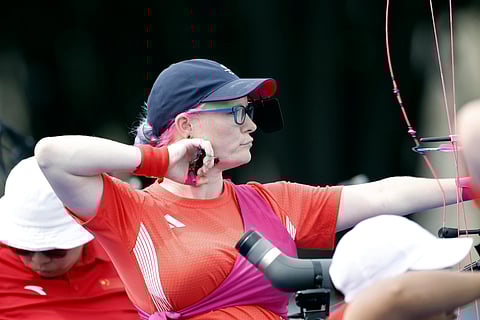 Britain's Jodie Grinham releases an arrow during the Paralympic Games in Paris on Thursday, Aug. 29, 2024. The British archer is competing while pregnant.