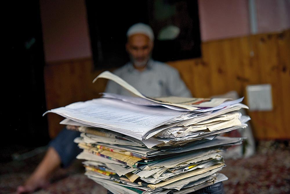 Photo: Yasir Iqbal : Keeping a Record: The victim’s family has preserved all newspaper clippings and court documents related to the case