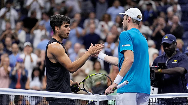 Botic van De Zandschulp, right, of the Netherlands, greets Carlos Alcaraz, of Spain, during the second round of the U.S. Open tennis championships. - AP Photo/Matt Rourke