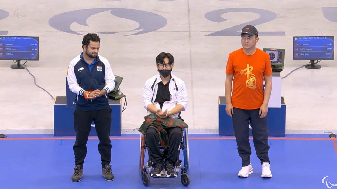 X : Manish Narwal (left) bagged silver in the men's P1 10m air pistol (SH1) event.