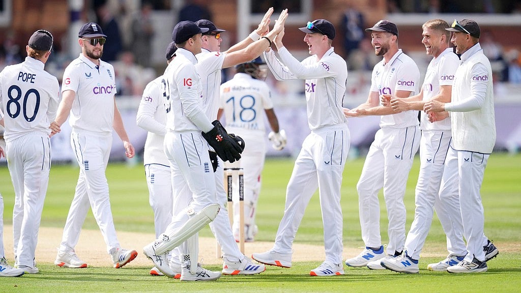 John Walton/PA via AP : England's Olly Stone celebrates taking the wicket of Sri Lanka's Pathum Nissanka at Lord's.