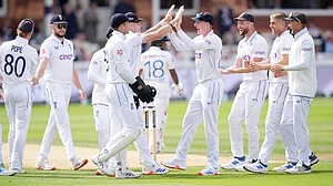 John Walton/PA via AP : England's Olly Stone celebrates taking the wicket of Sri Lanka's Pathum Nissanka at Lord's.
