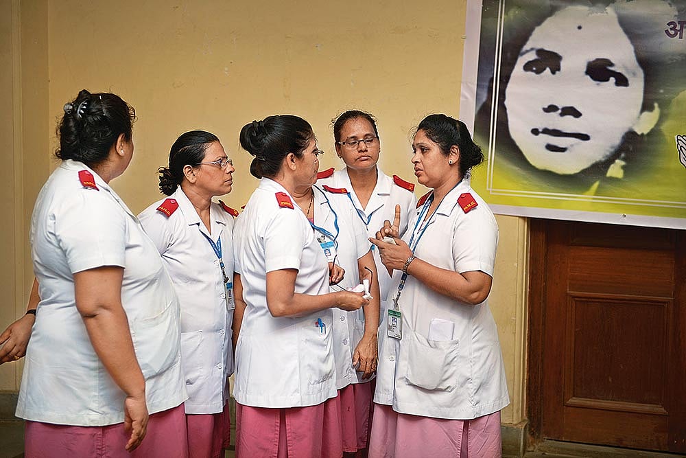 Photo: Getty Images : The ‘Second’ Home: Staff nurses gather outside Shanbaug’s ward the day she died